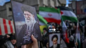 Protestors hold portraits of Iran's late supreme leader Ayatollah Ali Khamenei as they gather to protest against the US and Israel attack of Iran and the killing of the Supreme leader in front of Israel Consulate in Istanbul on March 1, 2026