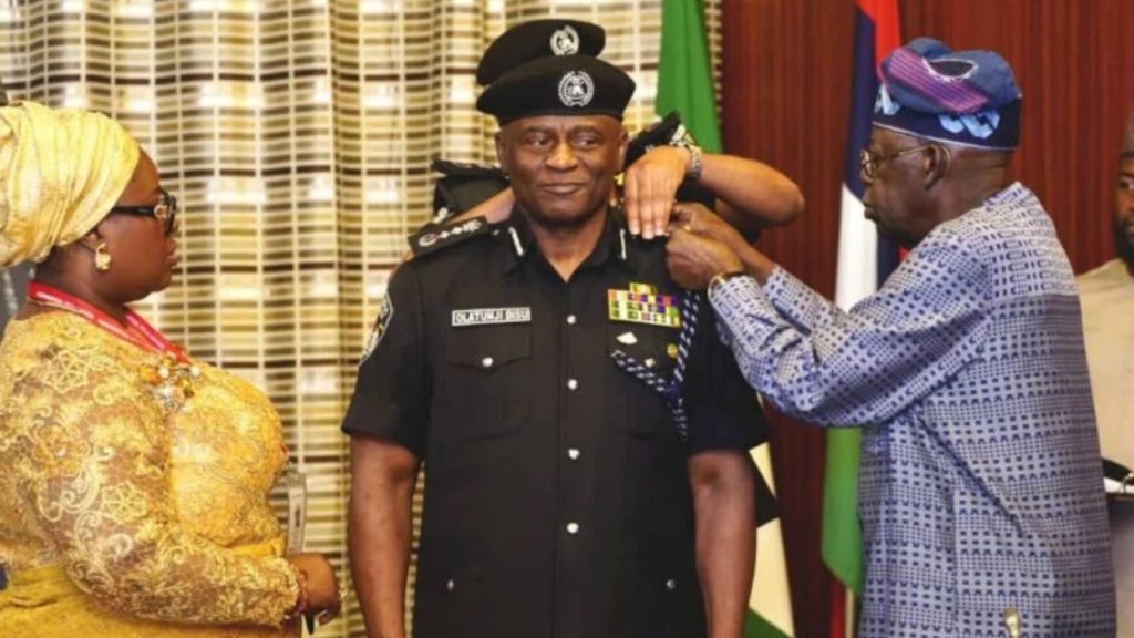 President Bola Ahmed Tinubu (right), Mrs. Olufunmilola Tunji Disu (left), decorated Mr. Tunji Disu with the rank of Acting Inspector-General of Police at the Presidential Villa, Abuja