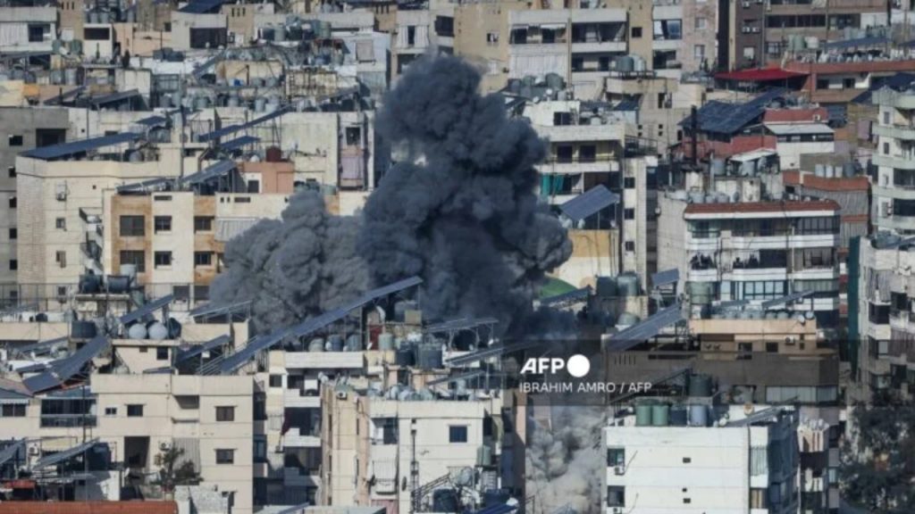 A plume of smoke rises from the site of an Israeli airstrike in the southern suburbs of Beirut's Haret Hreik neighborhood on March 4, 2026