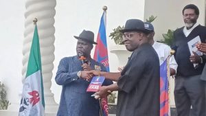 The lawmaker representing Bayelsa West Senatorial District, Senator Seriake Dickson, recieving the NDC Constitution