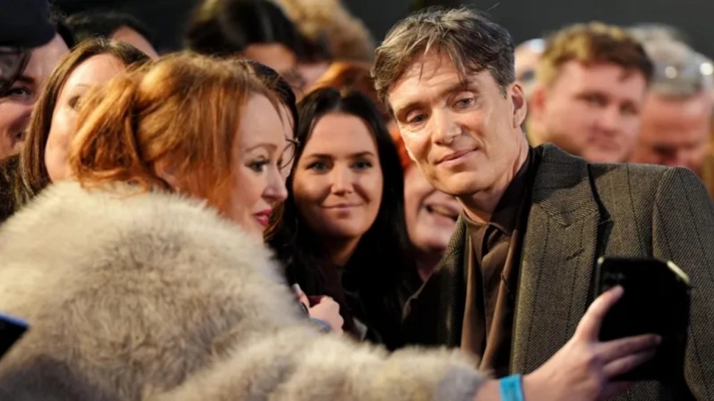 Cillian Murphy posing with fans at Peaky Blinders