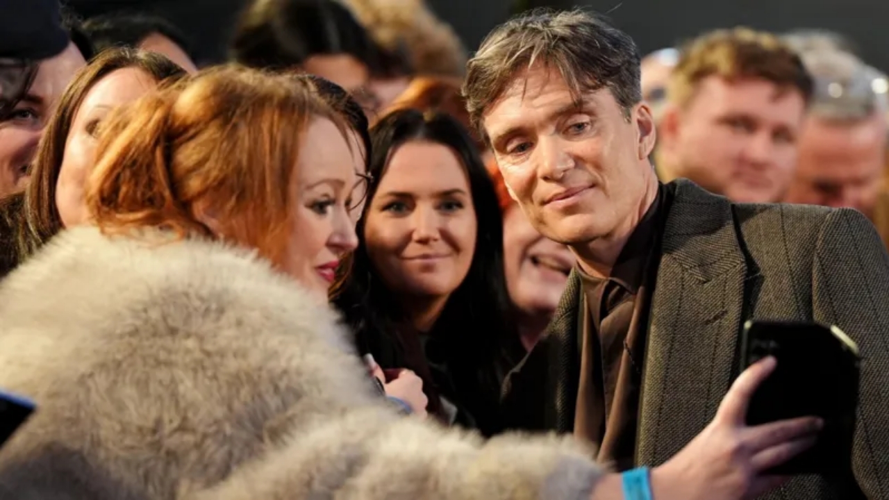 Cillian Murphy posing with fans at Peaky Blinders