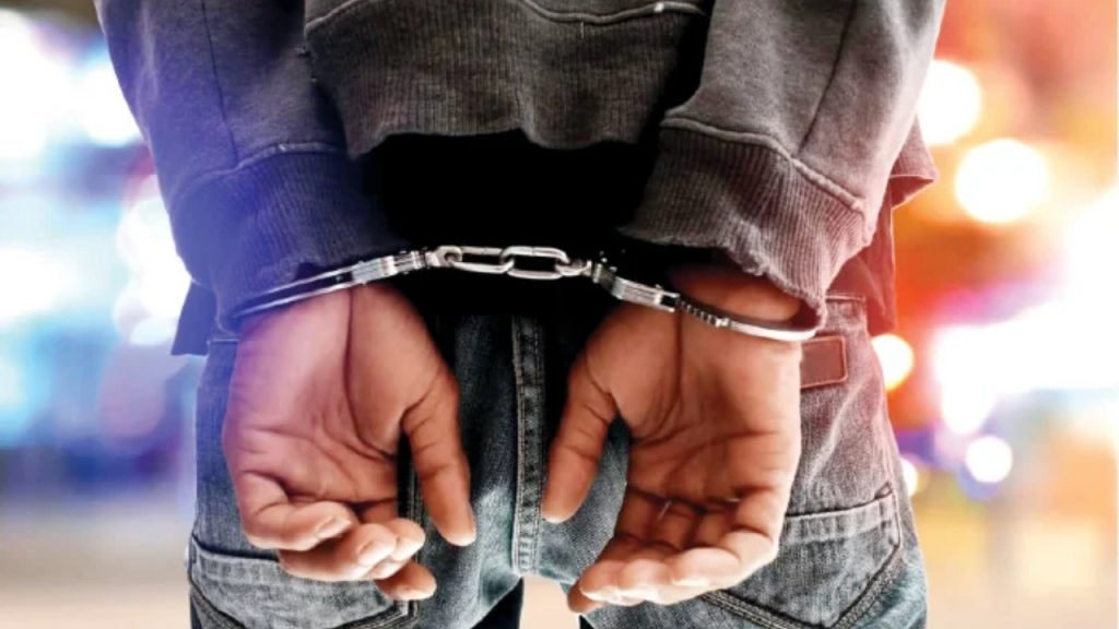 Illustrative photo of a someone in handcuffs - National News