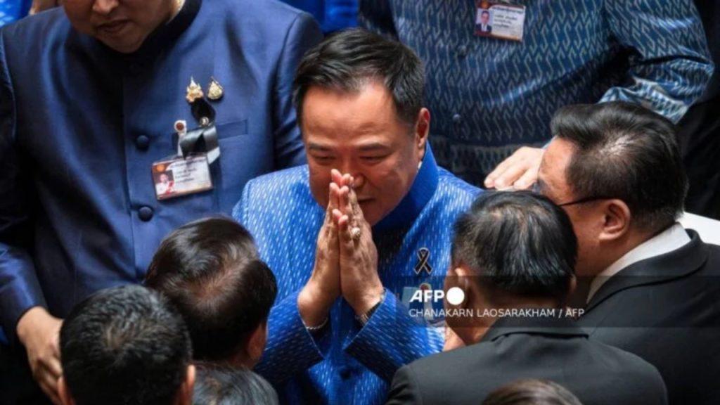 Thailand's caretaker Prime Minister and Bhumjaithai Party leader Anutin Charnvirakul (C) greets fellow party members after a vote at Parliament in Bangkok on March 19, 2026 - National News