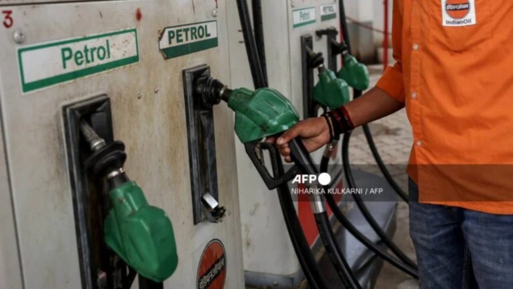 A petrol pump attendant picks up a nozzle to refuel a vehicle at an Indian Oil fuel station in Varanasi on March 10, 2026 - National News