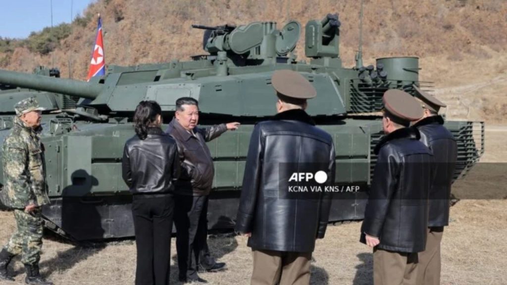 This picture taken on March 19, 2026 and released by North Korea's official Korean Central News Agency (KCNA) via KNS on March 20, 2026 shows North Korean leader Kim Jong Un and his daughter Kim Ju Ae visiting the Pyongyang Training Base No. 60 under the Capital City Defence Corps of the North Korean's Army - National News