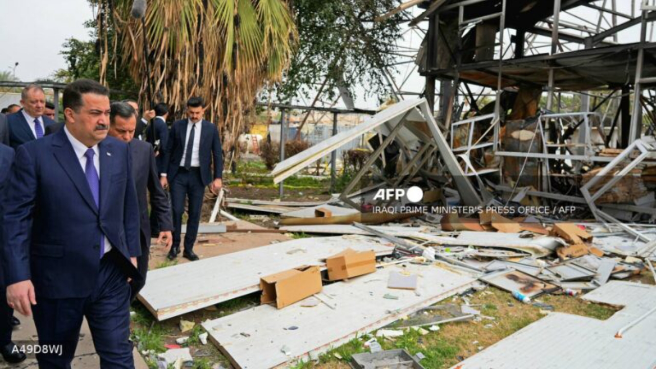 This handout photograph taken and released by the Iraqi Prime Minister's Press Office on March 22, 2026 shows Iraq's Prime Minister Mohammed Shia al-Sudani (L) inspecting the damage after a drone attack at an intelligence services building, in Baghdad - National News