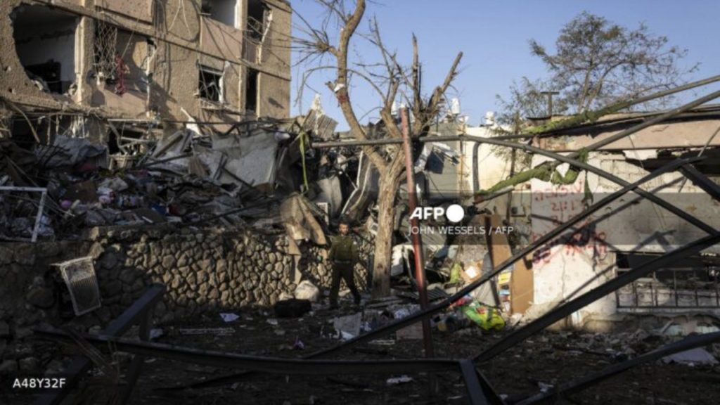 An Israeli security personnel inspects the site of an Iranian missile strike in Dimona on March 22, 2026 - National News