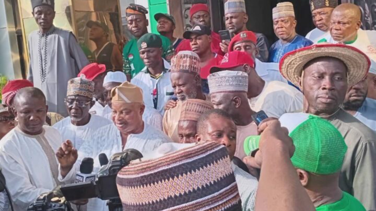 (Middle) National Union of Road Transport Workers President, Tajudeen Baruwa, addressing newsmen after taking control of the NURTW national secretariat in Abuja on Monday - National News