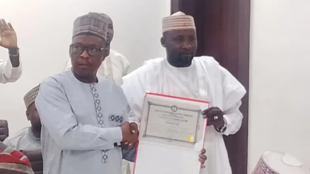 KANSIEC chairman Prof. Malumfashi presenting certificate of return to new Kumbotso LG chairman - National News