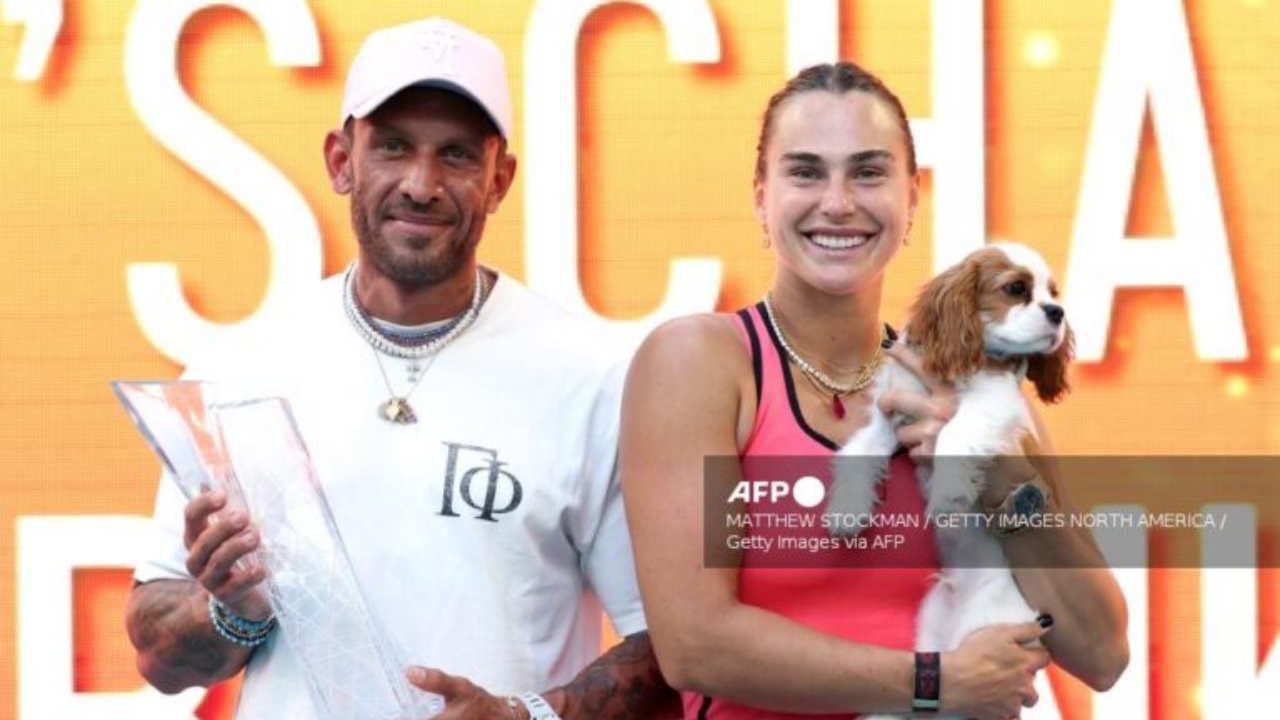 Aryna Sabalenka celebrates with the Butch Buchholz trophy, fiance Georgios Frangulis, and her dog Ash after defeating Coco Gauff of the United States during the Women's Singles Final on Day 12 of the Miami Open - National News