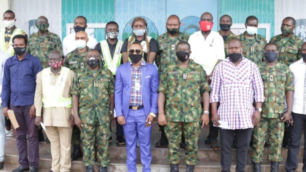 Mighty-Man in a group photo with security operatives - National News