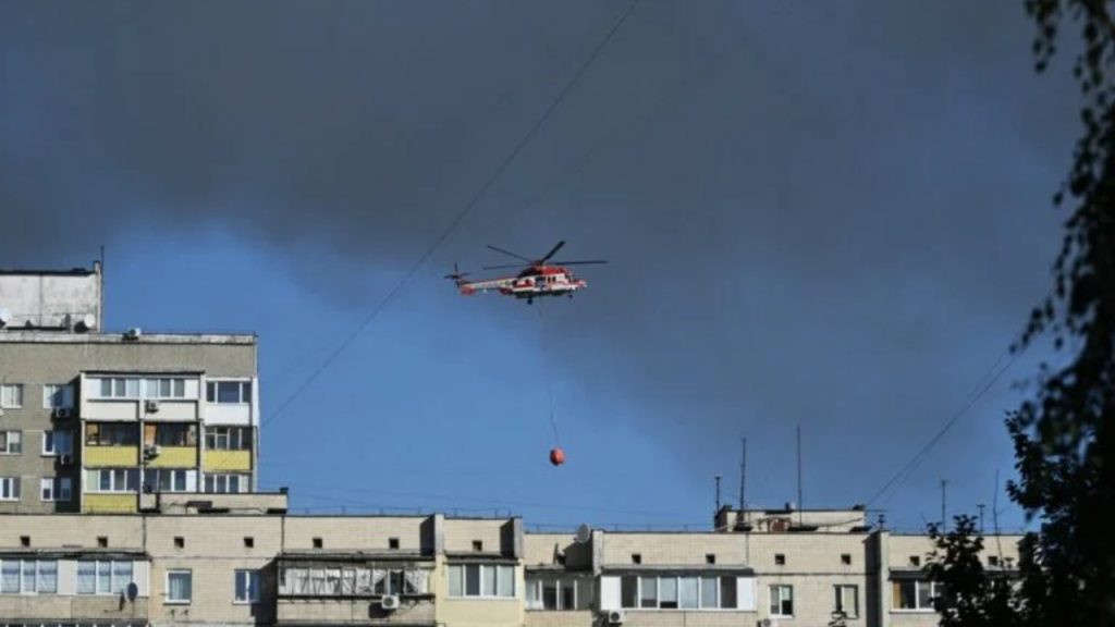 A firefighter helicopter flies as rescuers work at a site of a heavily damaged residential building following Russian drone and missile strikes in Kyiv on September 7, 2025, amid the Russian invasion of Ukraine - National News