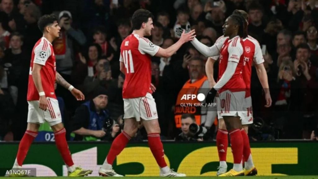 Arsenal's English midfielder #10 Eberechi Eze (R) celebrates with teammates after scoring their first goal during the UEFA Champions League, last 16 second leg football match between Arsenal and Bayer Leverkusen at the Emirates Stadium in north London on March 17, 2026 - National News