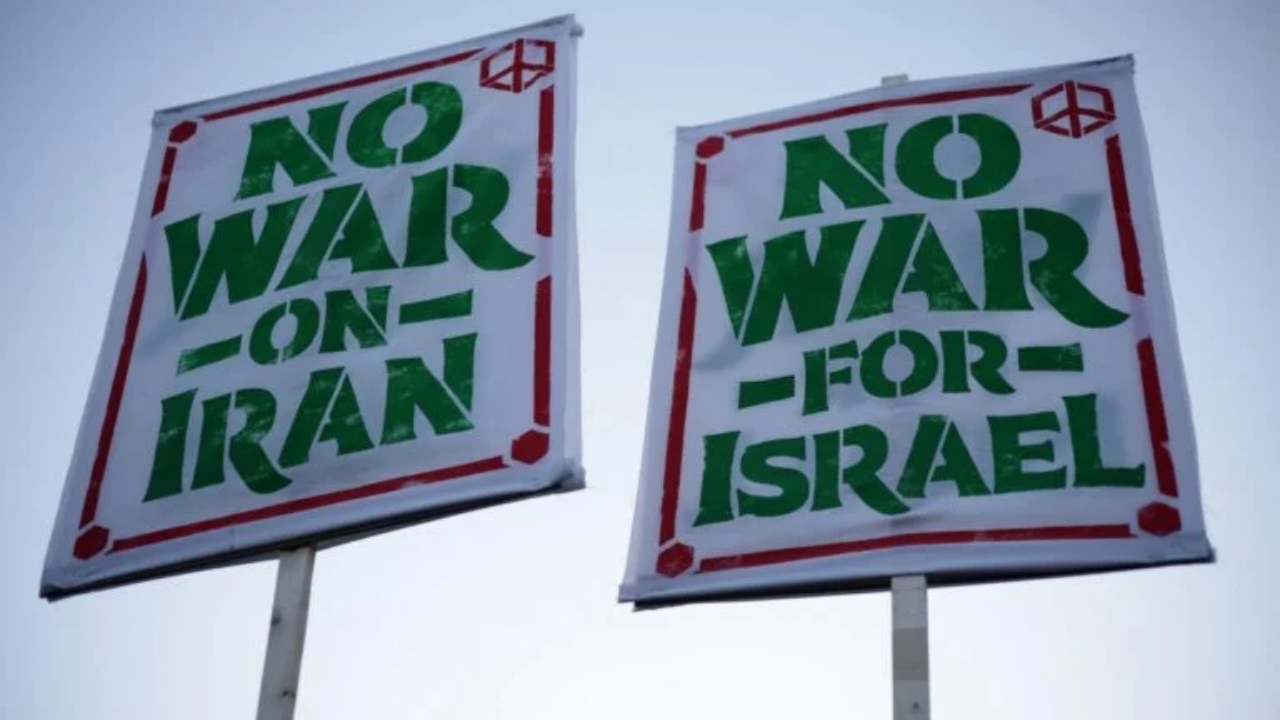 WASHINGTON, DC - APRIL 07: Anti-war demonstrators hold signs as they gather near the White House to protest the war in Iran on April 7, 2026 in Washington, DC. U.S. President Donald Trump announced that a temporary ceasefire has been reached between the U.S., Iran, and Israel, pausing attacks for about two weeks while Iran reopens the Strait of Hormuz and negotiations continue toward a longer-term agreement - National News