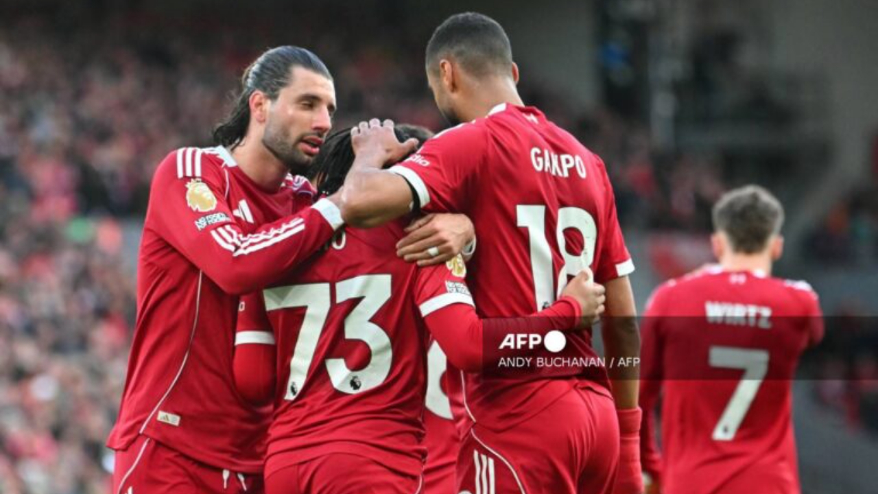 Liverpool's English striker #73 Rio Ngumoha celebrates with Liverpool's Hungarian midfielder #08 Dominik Szoboszlai (L) and Liverpool's Dutch striker #18 Cody Gakpo (R) after scoring the opening goal of the English Premier League football match between Liverpool and Fulham at Anfield in Liverpool, north west England on April 11, 2026 - National News