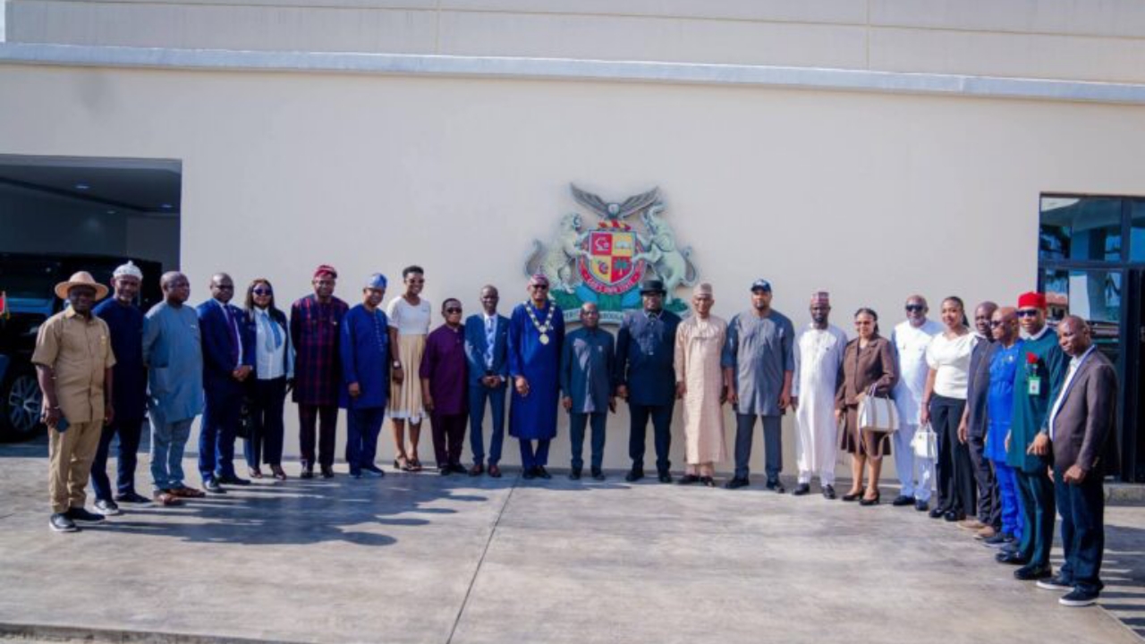 Gov. Otti in a group photography with the president and members of the Nigerian Institution of Estate Surveyors and Valuers - National News