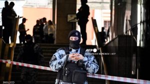 A Russian police officer blocks the entrance to the office building of Russian retailer Wildberries after an attempted raid in central Moscow on September 18, 2024 - National News