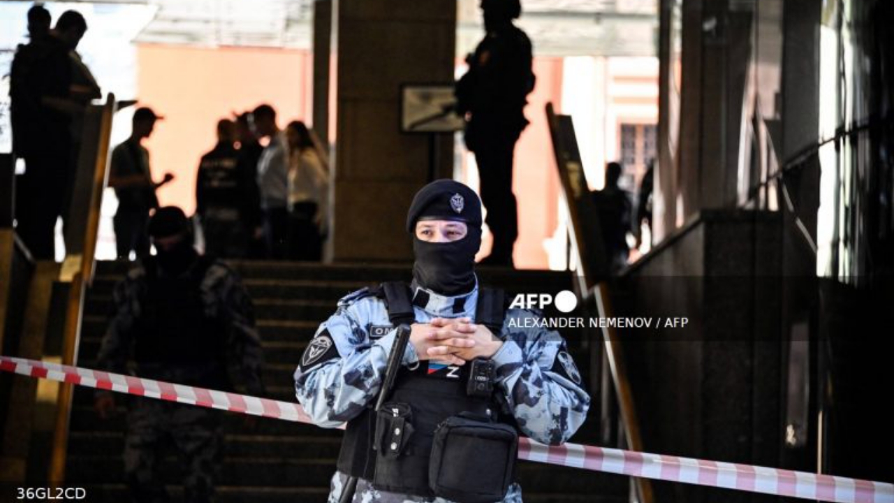 A Russian police officer blocks the entrance to the office building of Russian retailer Wildberries after an attempted raid in central Moscow on September 18, 2024 - National News