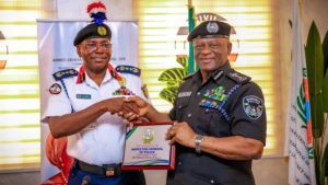 The Commandant General of the NSCDC, Ahmed Audi and Inspector General of Police, Tunji Disu during the IG's visit - National News