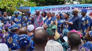 Senator Ayoola Agbola (with a microphone) addressing APC faithful and decampess during the programme in Ibadan - National News