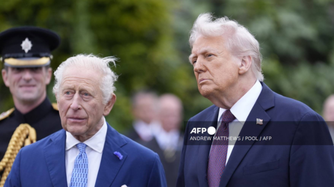 Britain's King Charles III (L) and US President Donald Trump (R) speak to military personnel following a Beating Retreat military ceremony on the East Lawn at Windsor Castle, in Windsor, on September 17, 2025, during the US President's second State Visit. US President Donald Trump arrived in Britain for an unprecedented second State Visit, with the UK government rolling out a royal red carpet welcome to win over the mercurial leader - National News