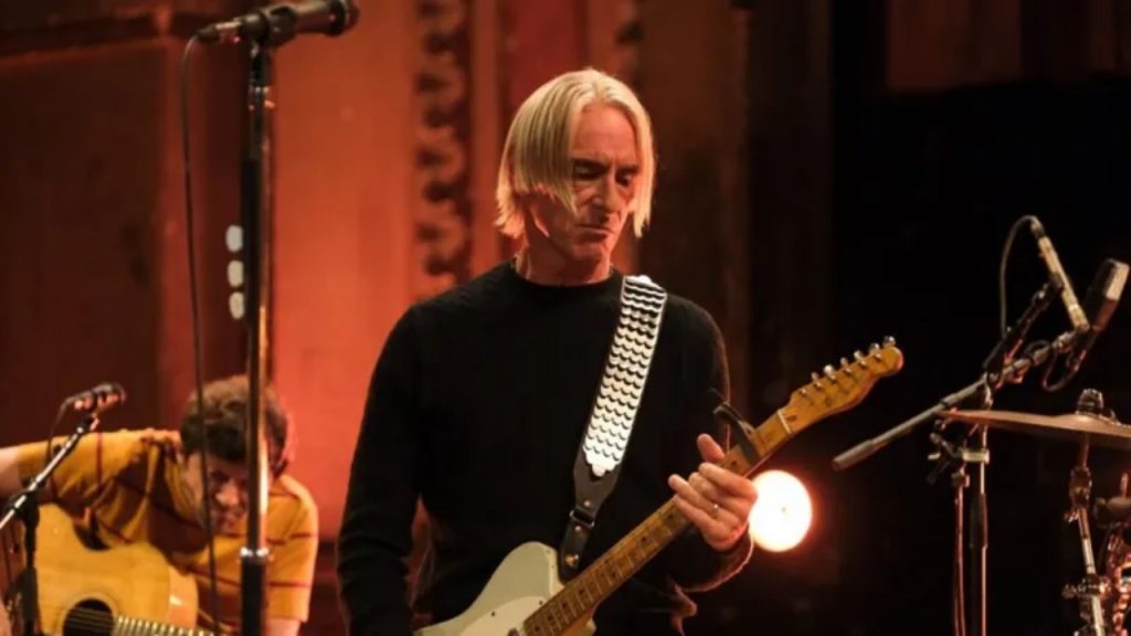 Paul Weller performing live with guitar during BBC studio session - National News
