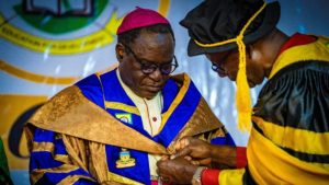 Kukah being decorated as Chancellor of COOU by Governor Chukwuma Soludo during the COOU convocation - National News