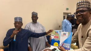 APC National Organising Secretary, Suleiman Argungu, presenting the governorship forms to a supporter of Senator Olamilekan Adeola, at the APC national headquarters - National News
