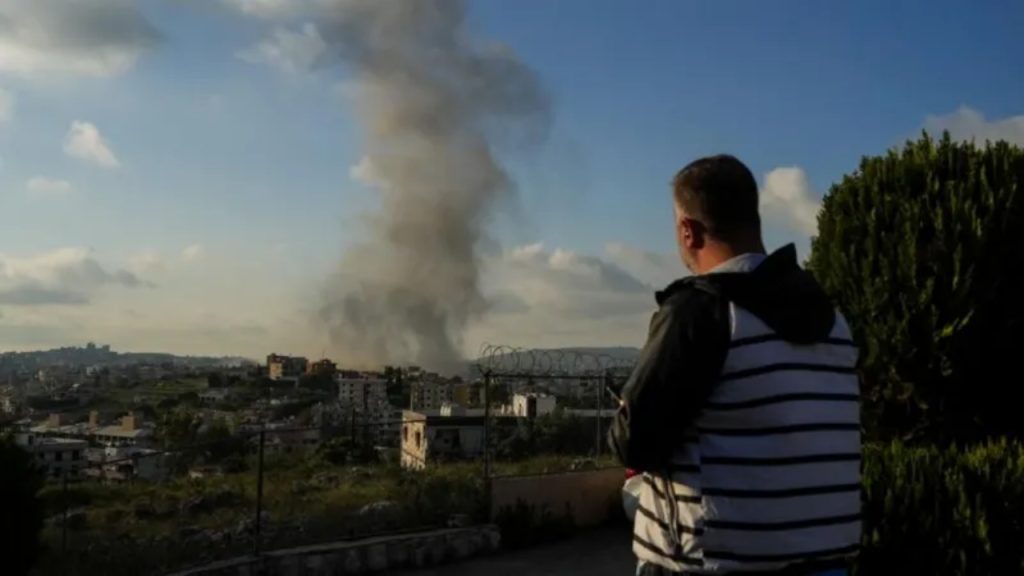 A man looks on following an air strike on Haboush in southern Lebanon on 1 May - National News