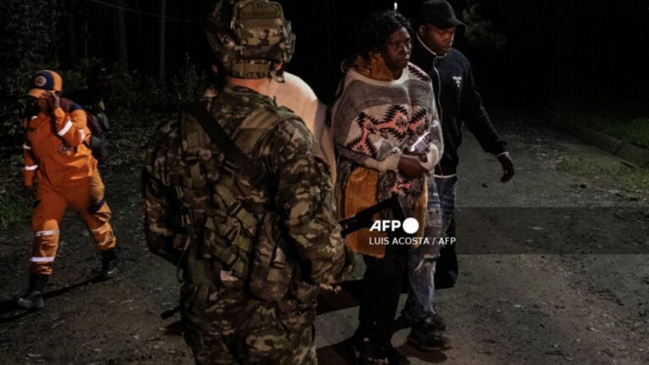 Relatives mourn the death of nine miners past a Colombian soldier after an explosion at a coal mine in Sutatausa, Cundinamarca department, Colombia on May 4, 2026. Nine miners died and six others were rescued following an explosion at a legal coal mine in central Colombia on May 4, 2026, according to the final tally released by authorities at the end of the search operation - National News