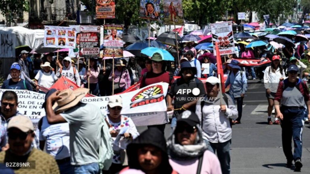 Teachers, members of the National Coordinator of Education Workers (CNTE), take part in a protest march demanding wage increases on Teachers' Day, in Mexico City, on May 15, 2026 - National News