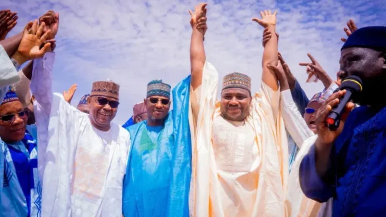 Governor Dikko Radda (2nd Left) raises the hand of Architect Usman Banye (right) after his emergence as APC consensus candidate for Rimi/Charanchi/Batagarawa Federal Constituency in Katsina State on Saturday - National News
