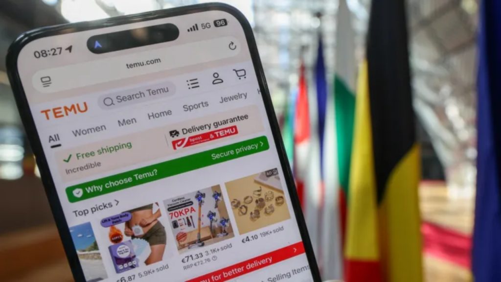 Smartphone displaying Temu app beside European Union flags in Brussels - National News